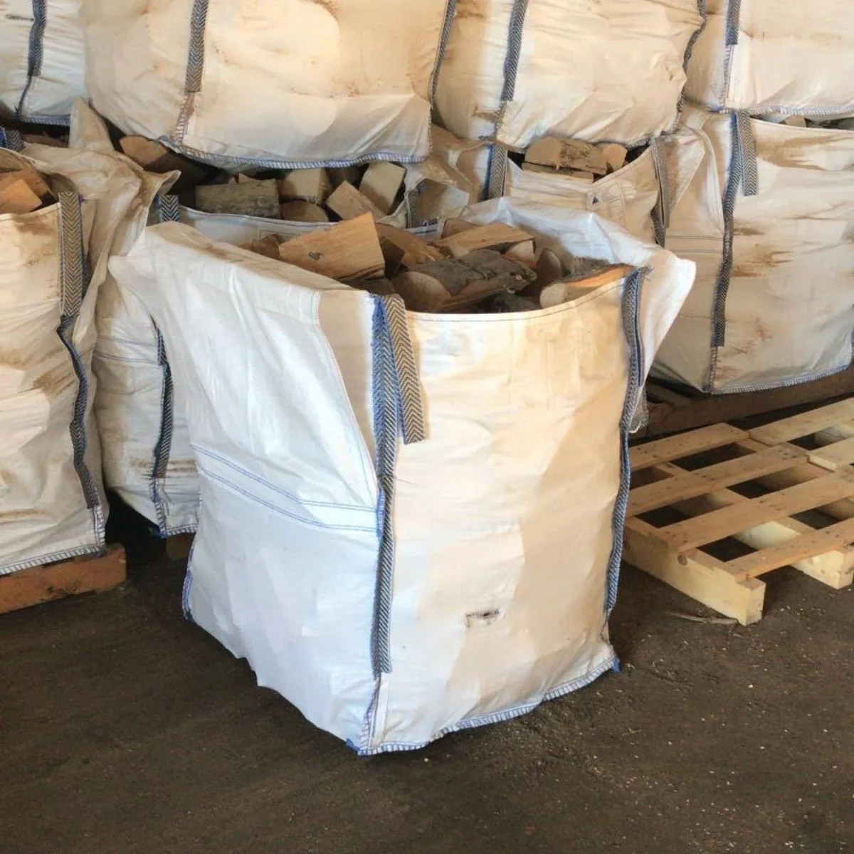 Jumbo Bag of Firewood Logs Jumbo bag of firewood logs in warehouse ready to be delivered